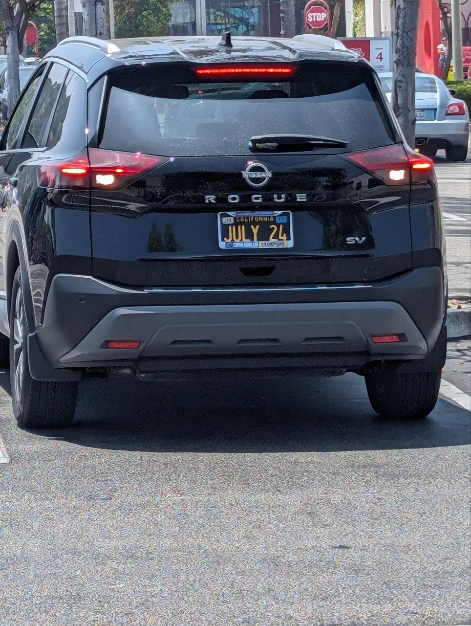 Black Car Parked In A Parking a black car parked in a parking lot